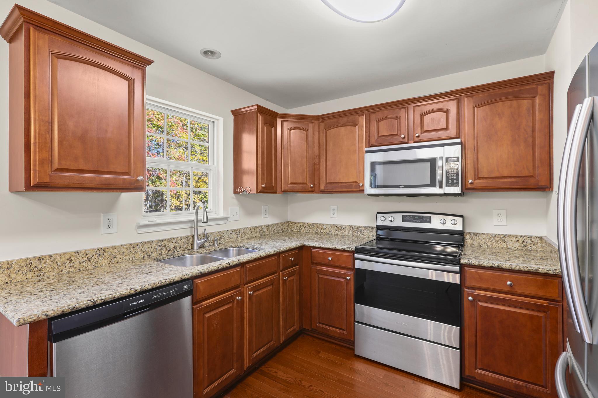 2826 Profitt Path Edgewood, MD 21040 - Photo 9 of 50 a kitchen with granite countertop cabinets stainless steel appliances a sink and window