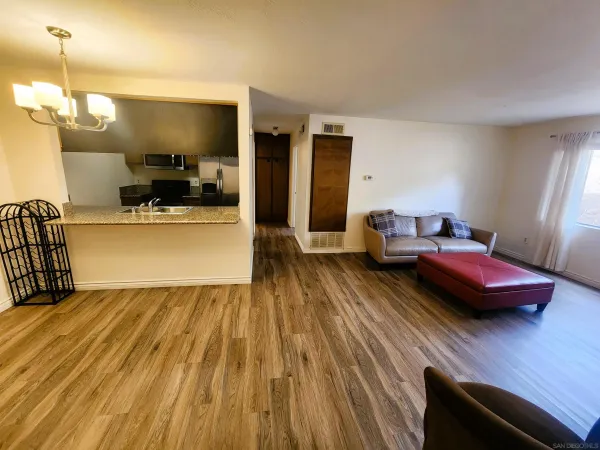 a front view of a building with a garden