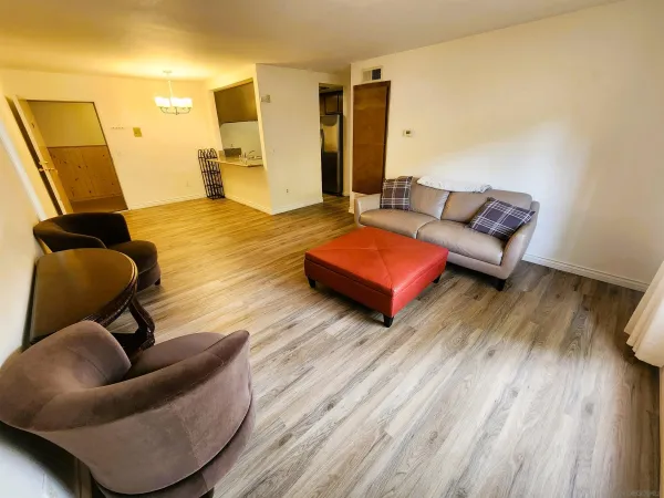 a view of a balcony with wooden fence and floor