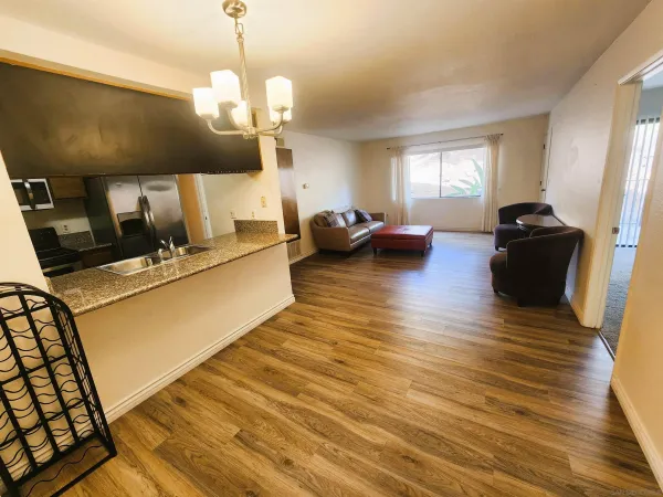 a dining room with furniture and wooden floor