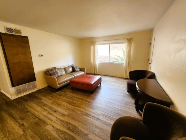 a bedroom with a bed and a potted plant