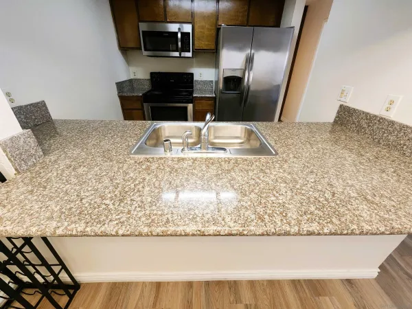 a view of a chairs and table in backyard