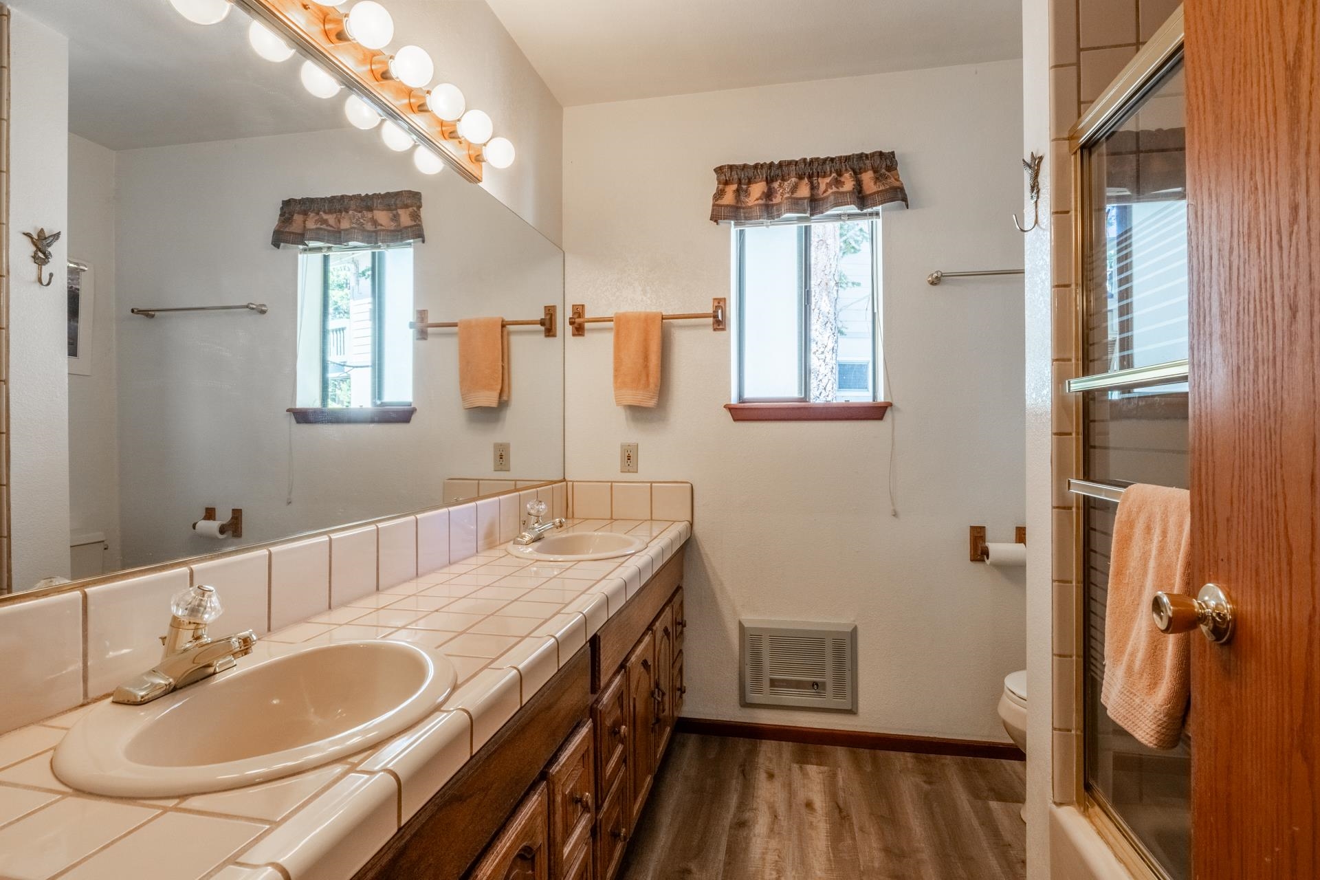 2281 Old Mammoth Road Mammoth Lakes, CA 93546 - Photo 21 of 27 Bathroom with wood finished floors, healthy amount of natural light, and double vanity