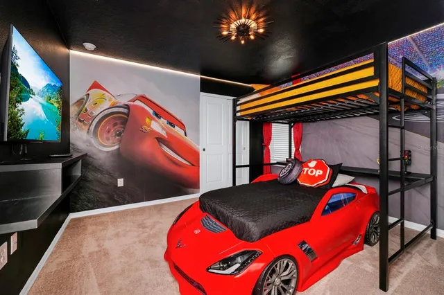 a bedroom with a bed and a painting on the wall