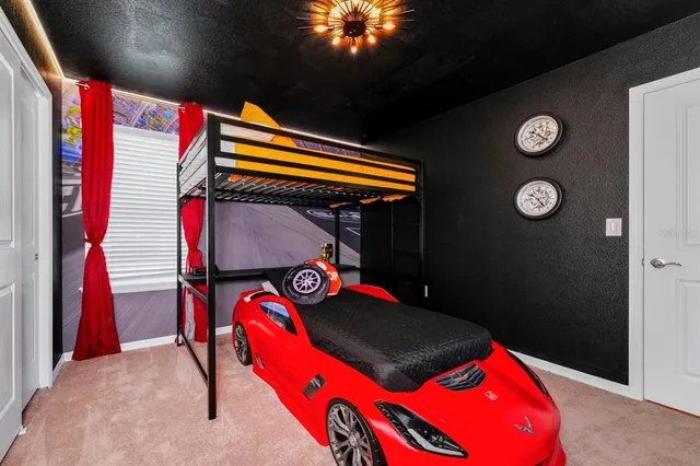 a bed room with a bed and a lamp