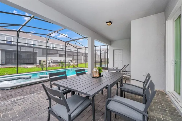 a table and chairs in front of a house