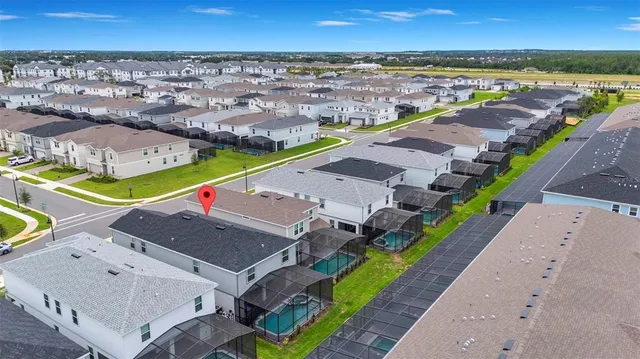 an aerial view of a house with a garden