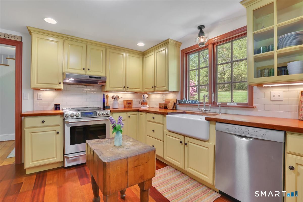 292 Parmelee Hill Road Durham, CT 06422 - Photo 9 of 39 Timeless remodeled kitchen with Brazilian cherry floors, stainless appliances, and Shaws fireclay farmhouse sink