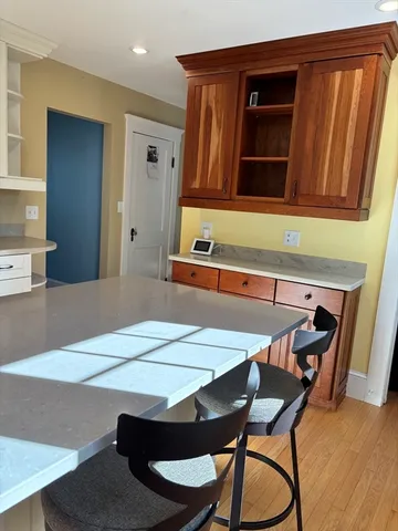 a dining room with a table and chairs