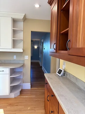 a kitchen with kitchen island a sink and a stove