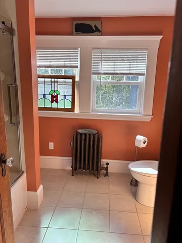 a bathroom with a toilet a sink and a bath tub