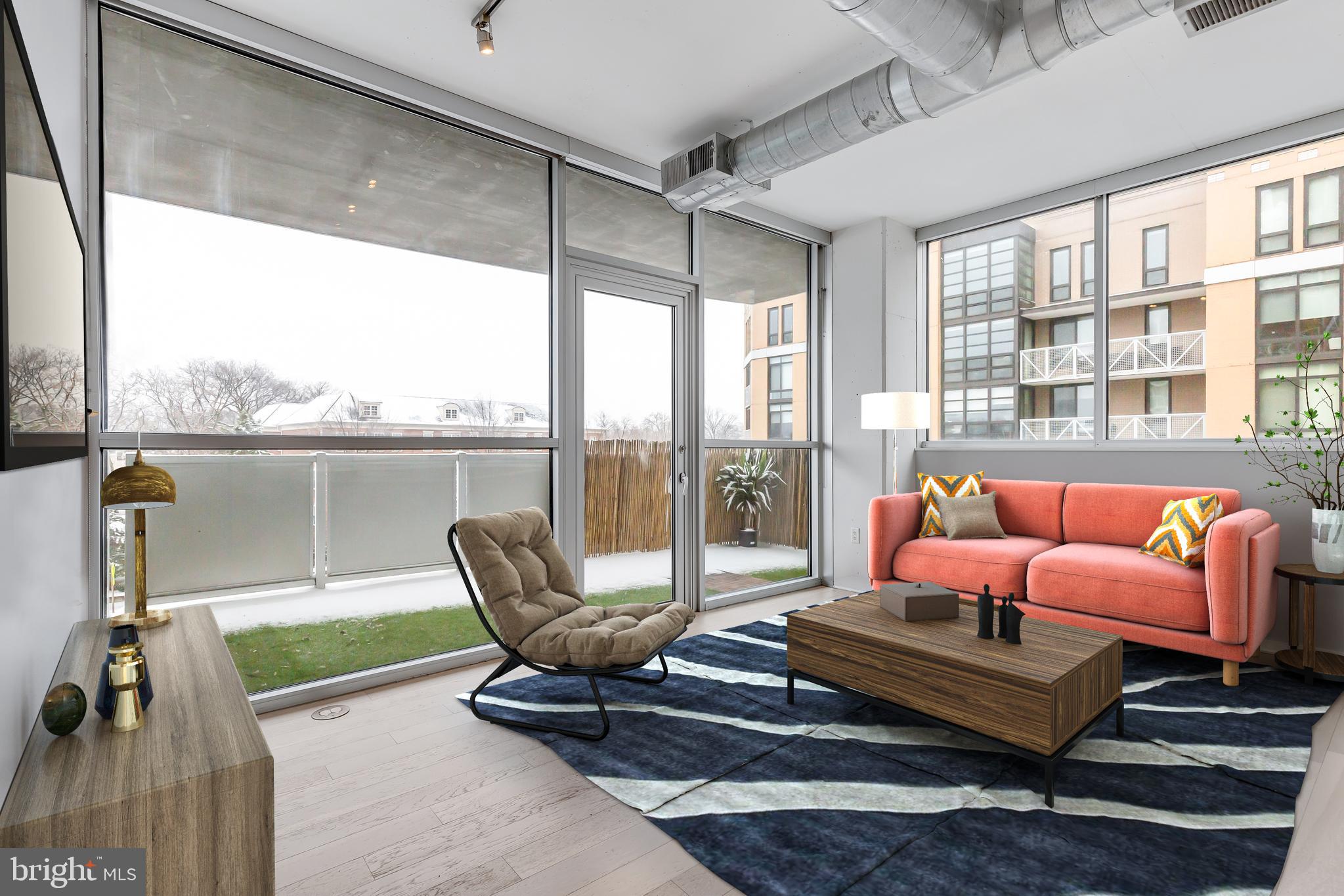 3409 Wilson Boulevard, Unit 309 Arlington, VA 22201 - Photo 1 of 30 a living room with furniture and a floor to ceiling window