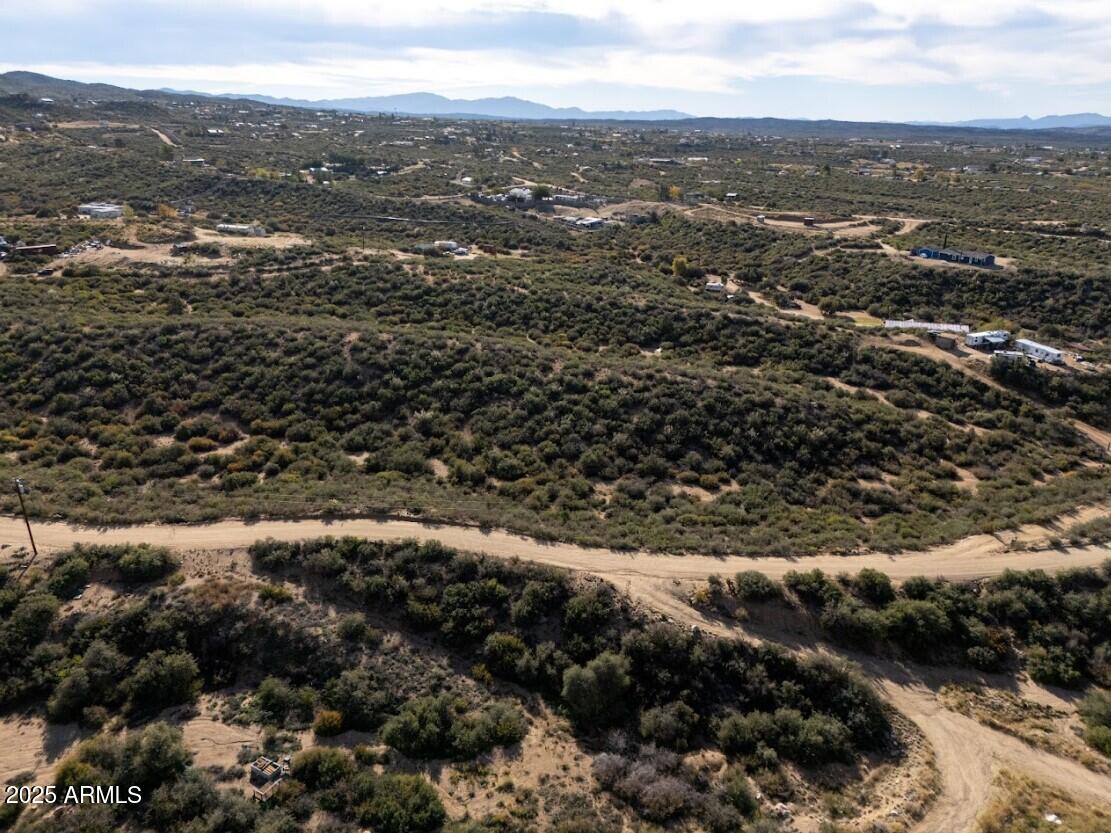 8155 West Framingham Road, Unit 219 Kirkland, AZ 86332 - Photo 9 of 22 an aerial view of residential house with green space
