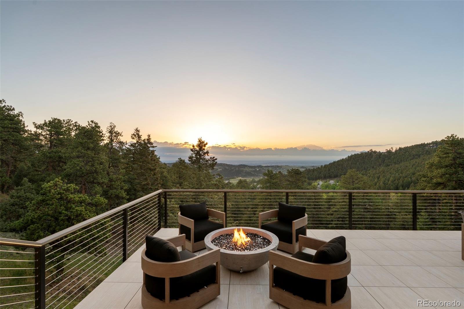 730 Genesee Mountain Road Golden, CO 80401 - Photo 42 of 50 a view of a roof deck with couches and wooden floor
