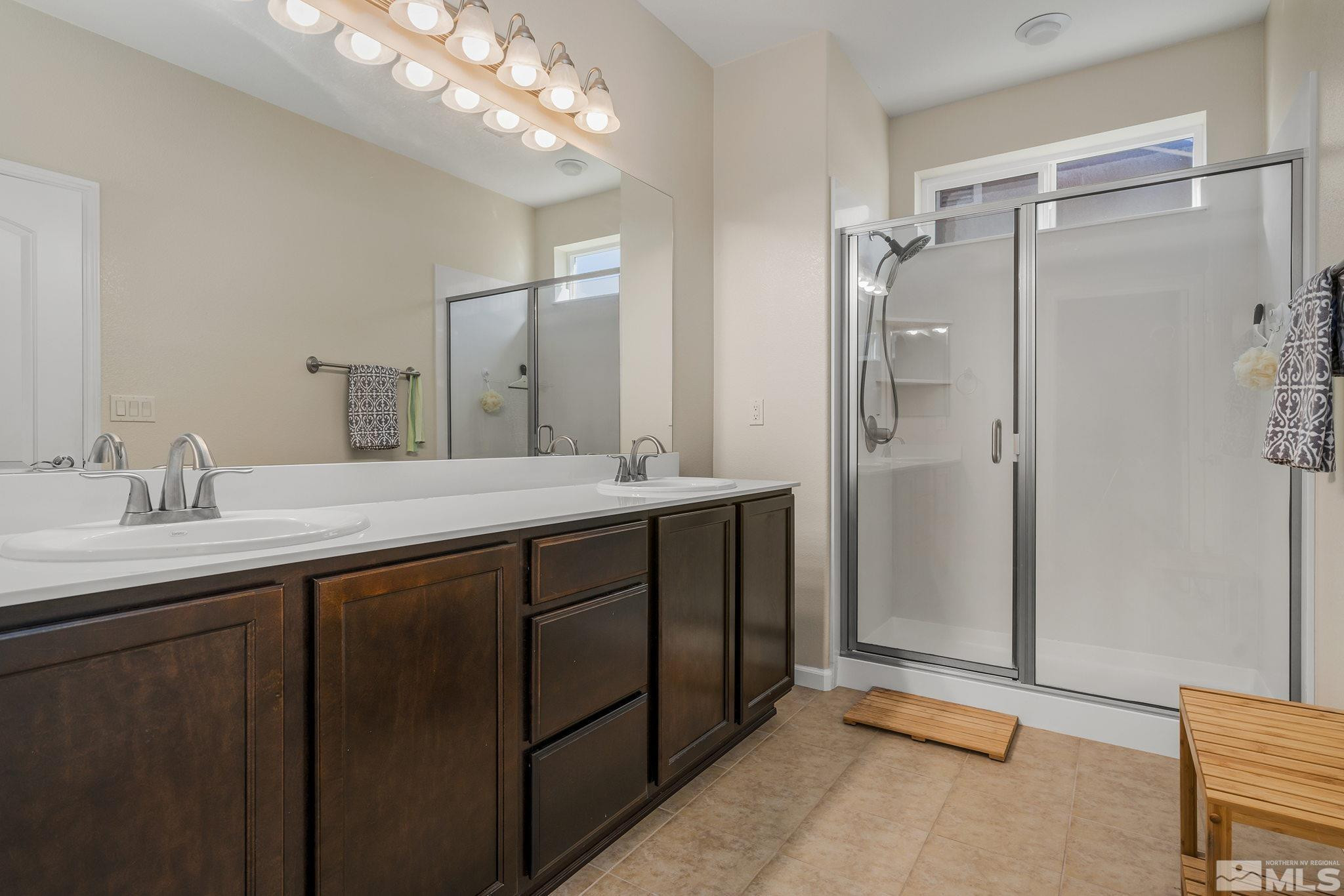 2249 Dominic Drive Reno, NV 89521 - Photo 15 of 22 a bathroom with a double vanity sink mirror and shower