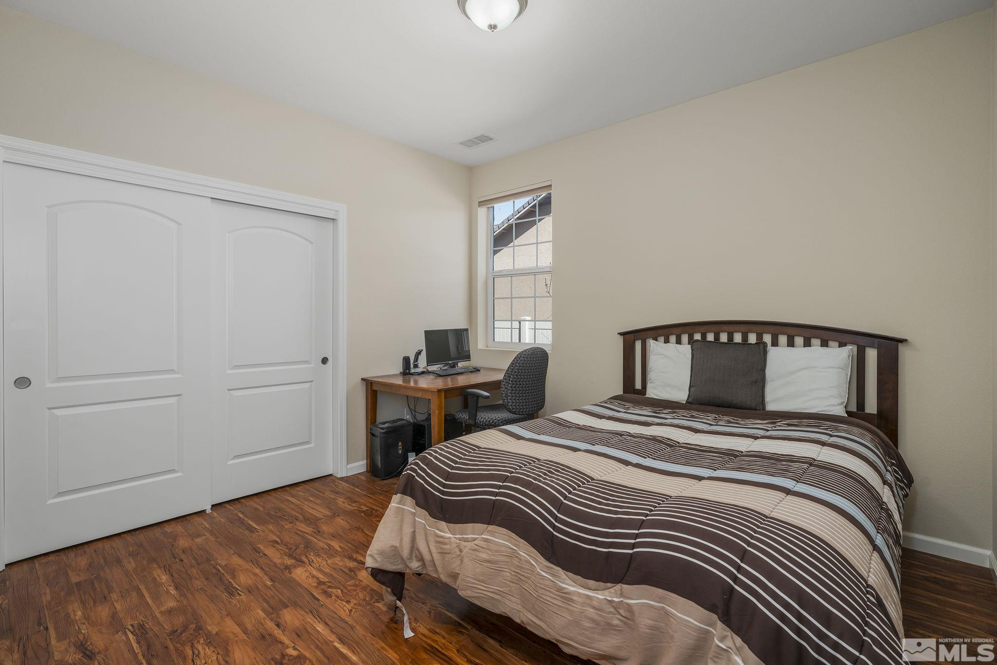 2249 Dominic Drive Reno, NV 89521 - Photo 16 of 22 a bedroom with a bed and a window