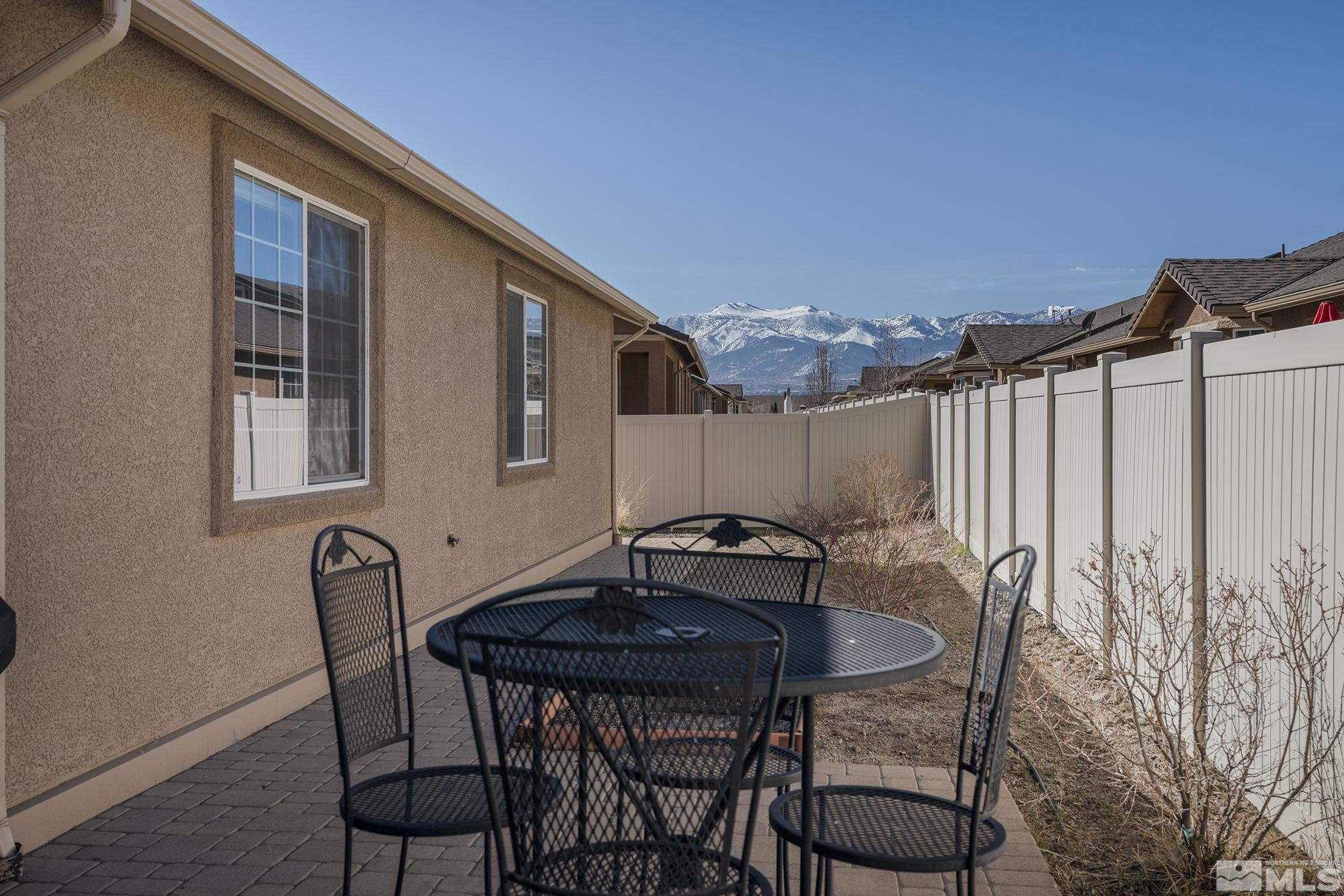 2249 Dominic Drive Reno, NV 89521 - Photo 21 of 22 a backyard of a house with table and chairs