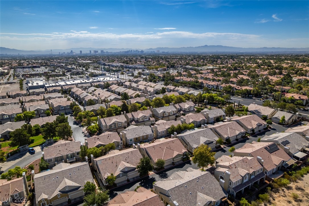 1004 Collingtree Street Las Vegas, NV 89145 - Photo 3 of 41 Aerial perspective of suburban area featuring a mountain backdrop
