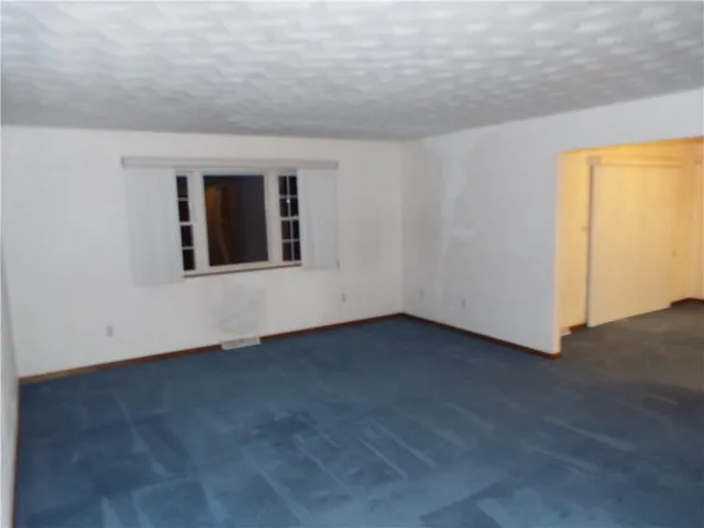 a kitchen with a stove and a refrigerator