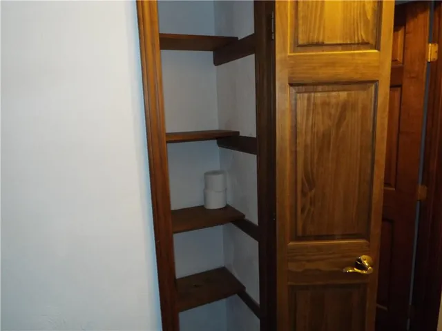 an empty room with a kitchen