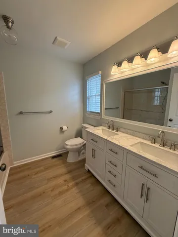 a bathroom with a glass shower door