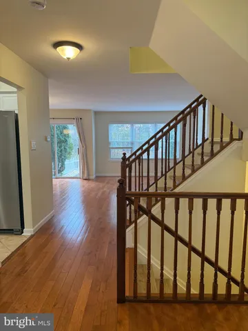 a view of staircase with wooden floor