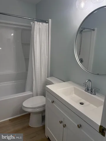 a bathroom with a shower and a toilet