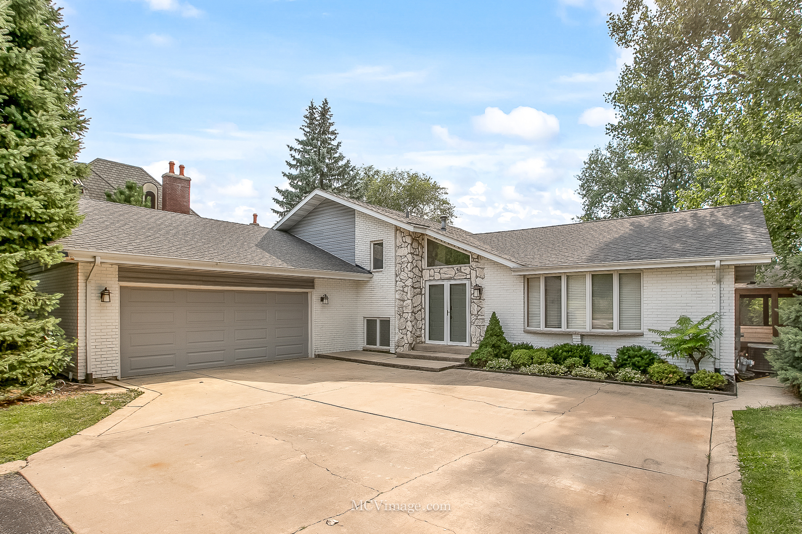 front view of a house with a yard