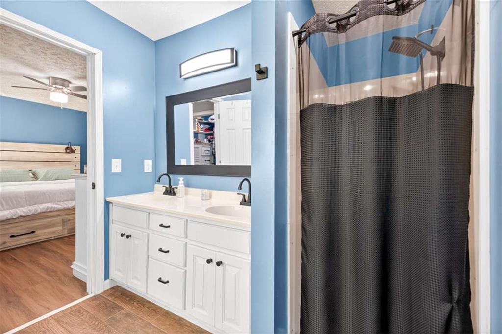386 Ridgewood Drive Pendergrass, GA 30567 - Photo 29 of 50 a bathroom with a double vanity sink and mirror