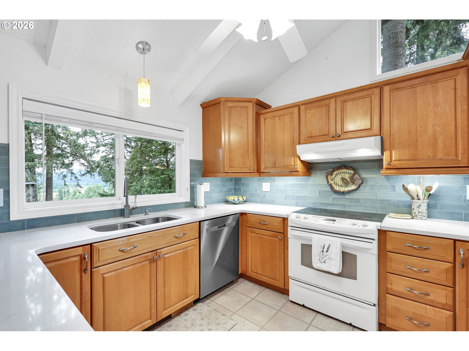 88108 Tiki Lane Springfield, OR 97478 - Photo 16 of 48 a kitchen with stainless steel appliances granite countertop a sink stove and cabinets