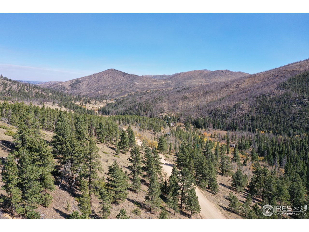 13729 Pingree Park Road Bellvue, CO 80512 - Photo 19 of 29 a view of a city with mountains in the background