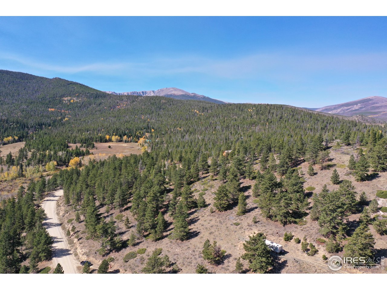 13729 Pingree Park Road Bellvue, CO 80512 - Photo 22 of 29 a view of a city with mountains in the background