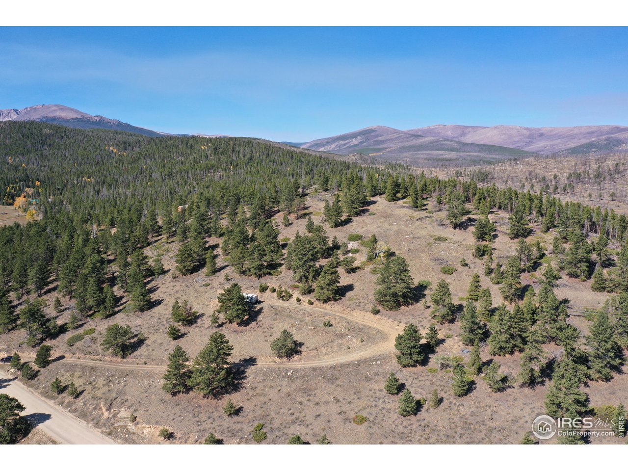 13729 Pingree Park Road Bellvue, CO 80512 - Photo 27 of 29 a view of a field with a mountain in the background