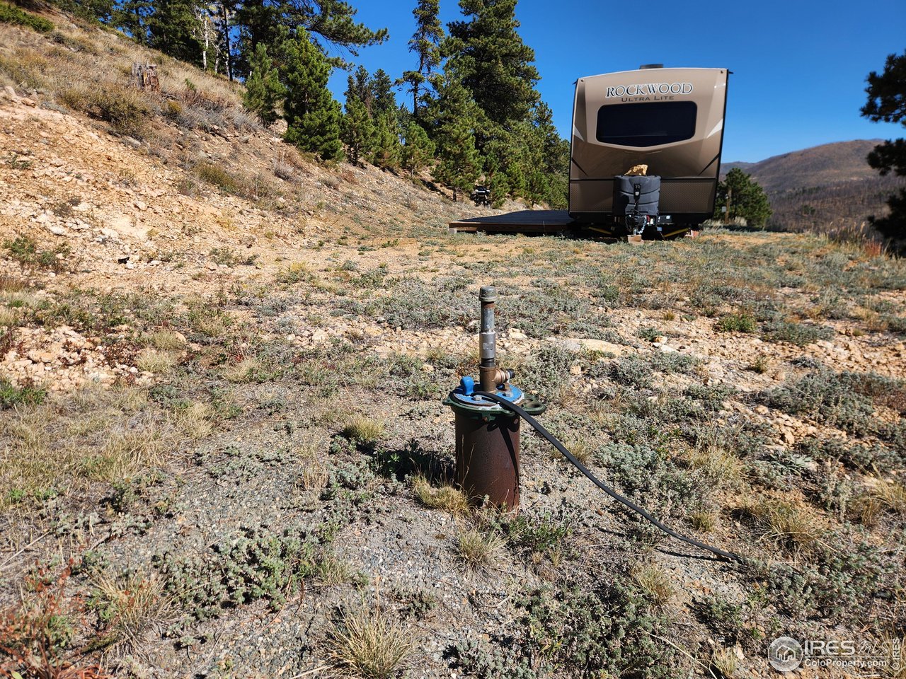 13729 Pingree Park Road Bellvue, CO 80512 - Photo 6 of 29 a fire hydrant in the middle of a field