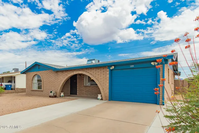 a front view of a house with a garage