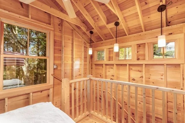 a bathroom with a sink and large windows