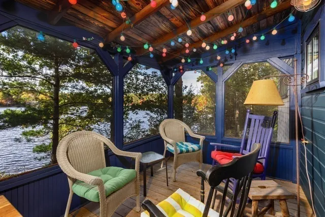 a view of a chairs and table in patio with wooden fence