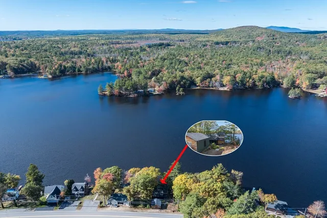 an aerial view of a house with a table and a chair