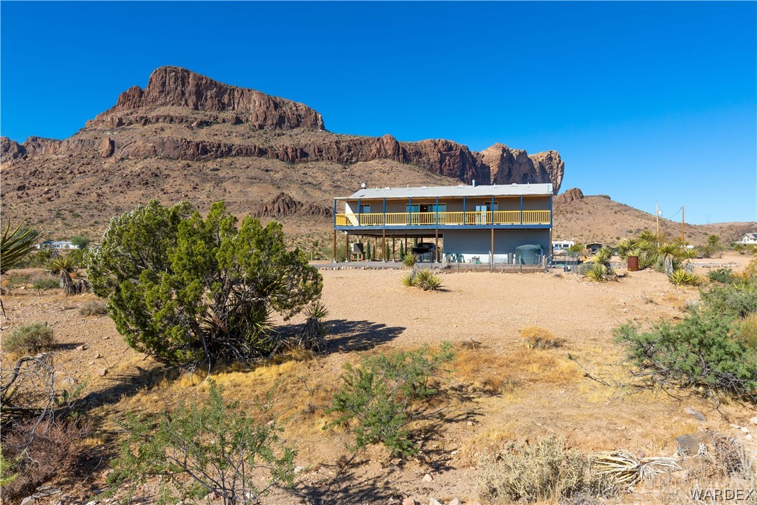 2136 Dewey Road Golden Valley, AZ 86413 - Photo 2 of 44 a view of a house with a yard covered in snow