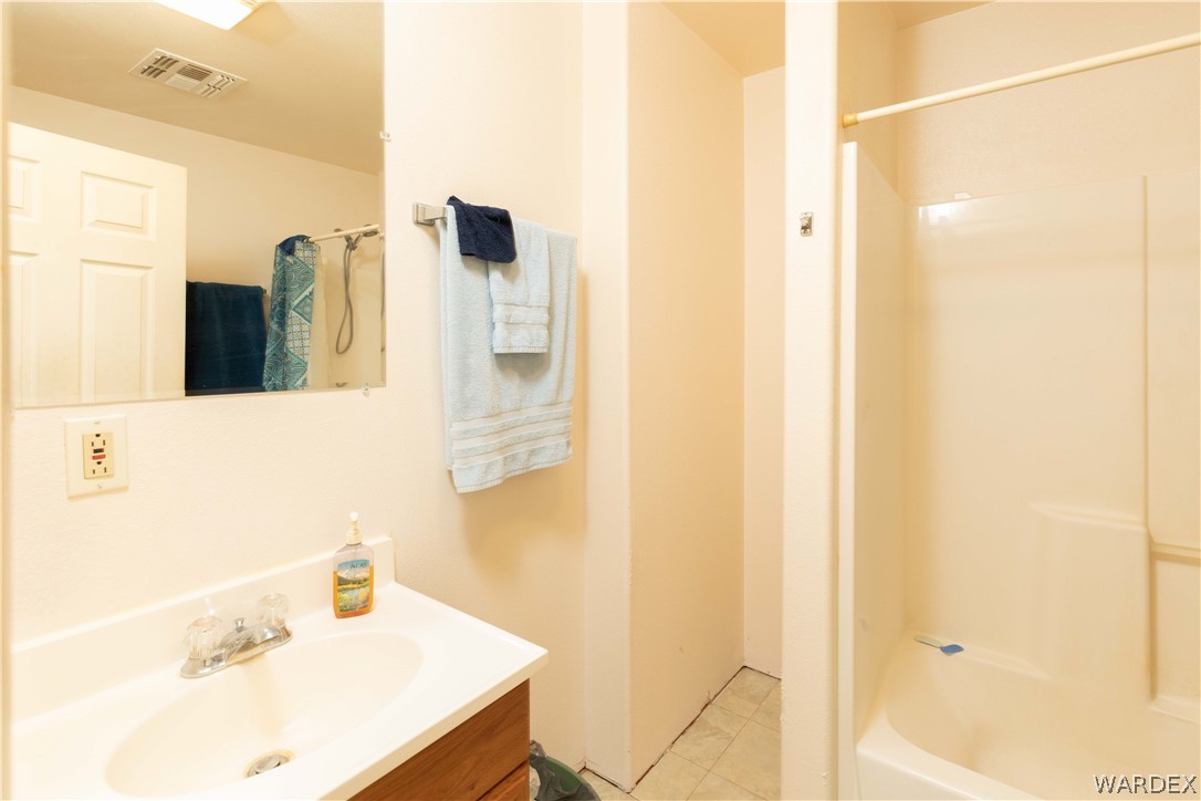 2136 Dewey Road Golden Valley, AZ 86413 - Photo 22 of 44 a bathroom with a sink and a mirror