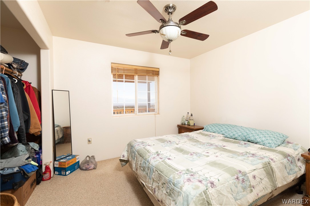 2136 Dewey Road Golden Valley, AZ 86413 - Photo 24 of 44 a bedroom with a bed and a window