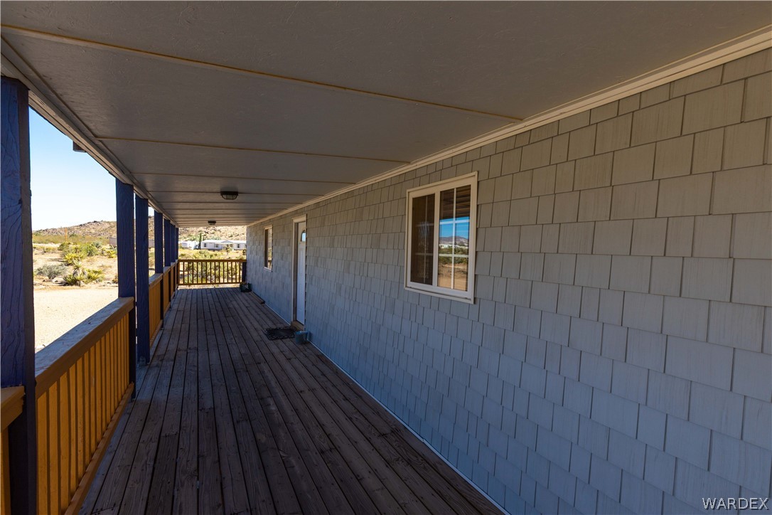 2136 Dewey Road Golden Valley, AZ 86413 - Photo 30 of 44 a view of a balcony with wooden floor