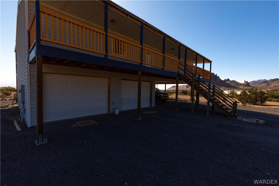 2136 Dewey Road Golden Valley, AZ 86413 - Photo 33 of 44 a front view of a house with a yard