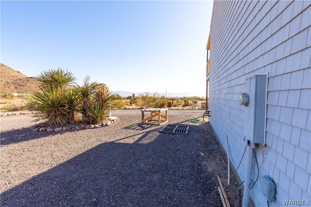 2136 Dewey Road Golden Valley, AZ 86413 - Photo 36 of 44 a view of a terrace with a table and chairs
