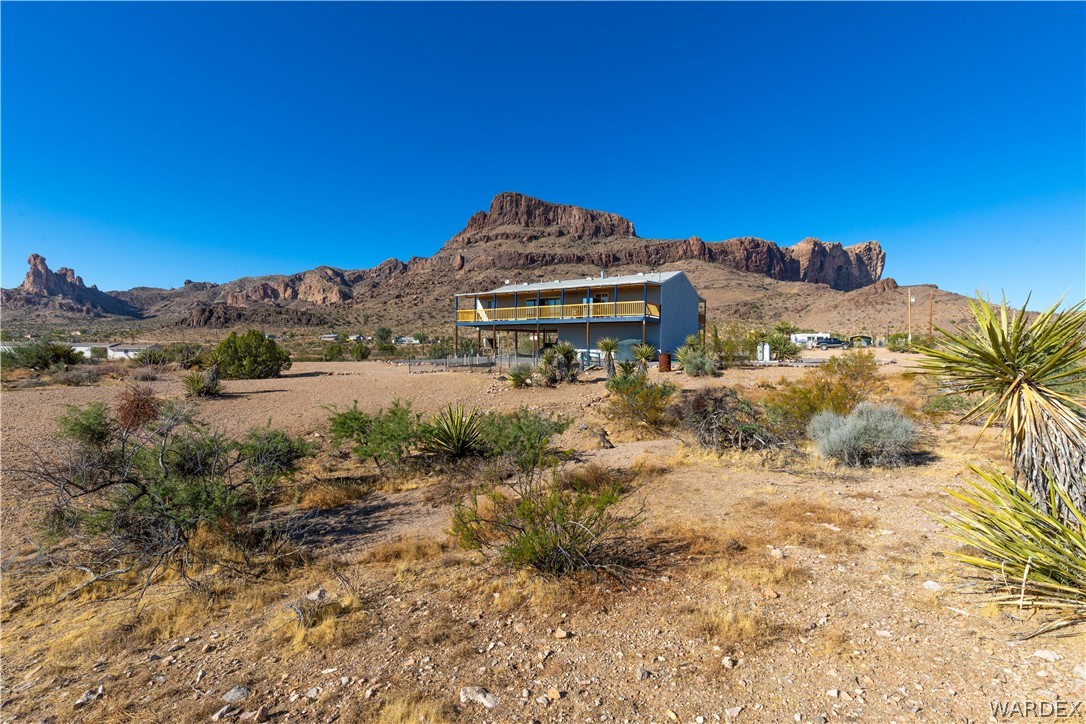 2136 Dewey Road Golden Valley, AZ 86413 - Photo 42 of 44 a view of a large building with a mountain in the background
