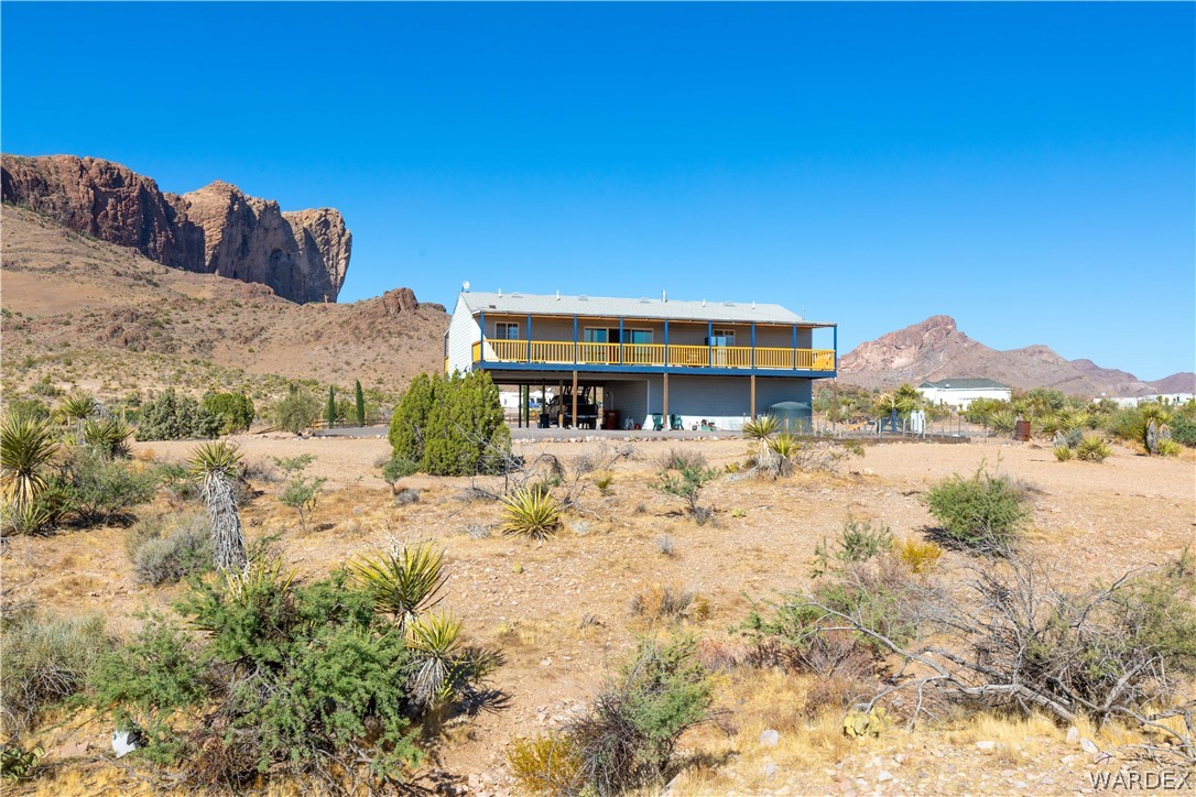 2136 Dewey Road Golden Valley, AZ 86413 - Photo 44 of 44 a front view of a house with a yard