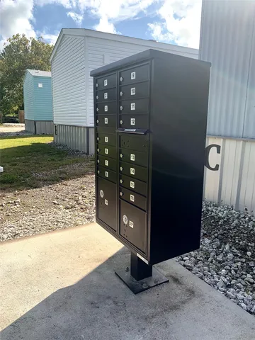a view of a house with a yard and garage