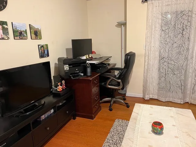 a room with furniture and flat screen tv