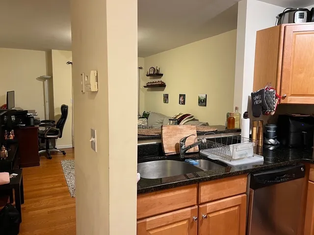 a kitchen with a sink and a stove top oven