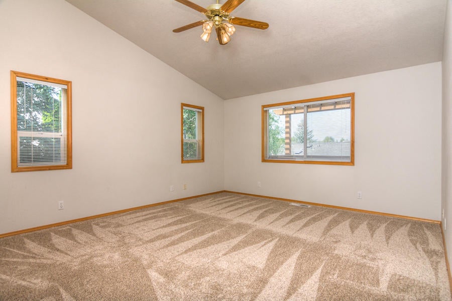 3207 Southwest 35th Street Redmond, OR 97756 - Photo 23 of 39 Master bedroom with lots of windows